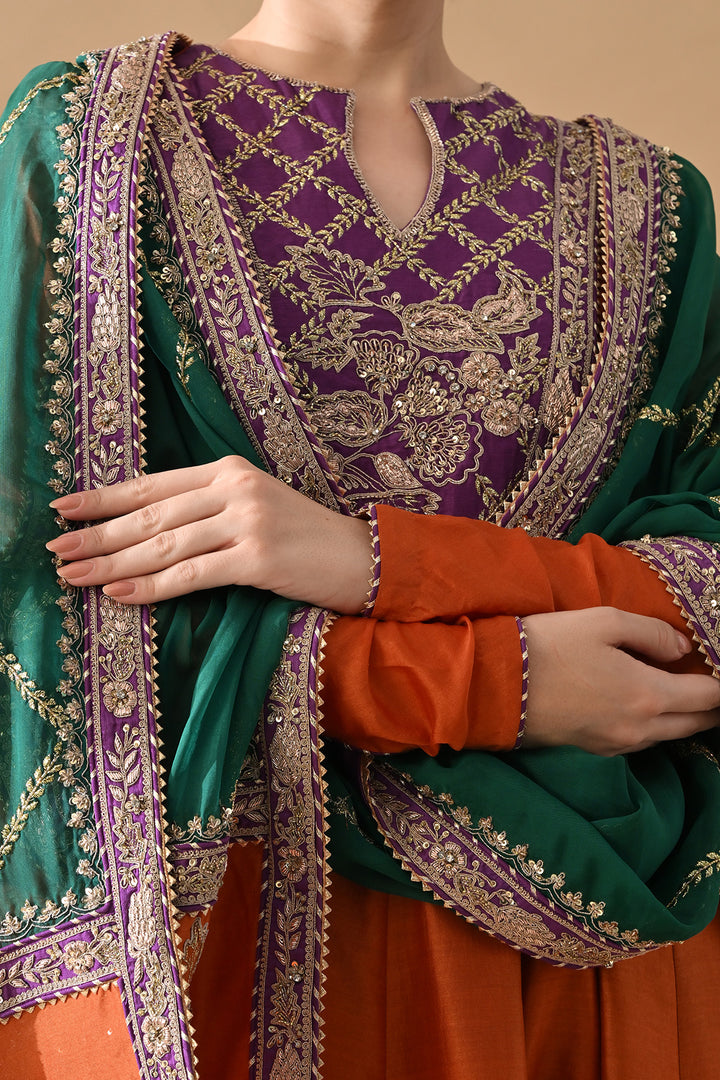 Rust Orange Embroidered Kurta Set with Purple Accents and Green Dupatta