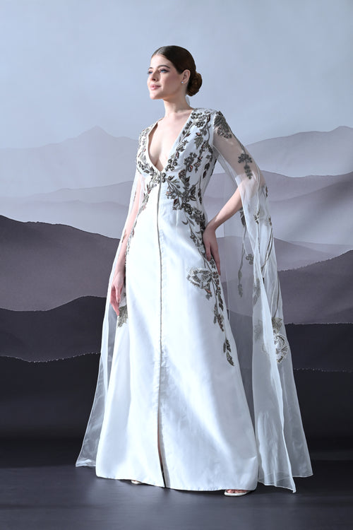 Ivory Gown with Hand-Embroidered Motifs and Sheer Cape Sleeves