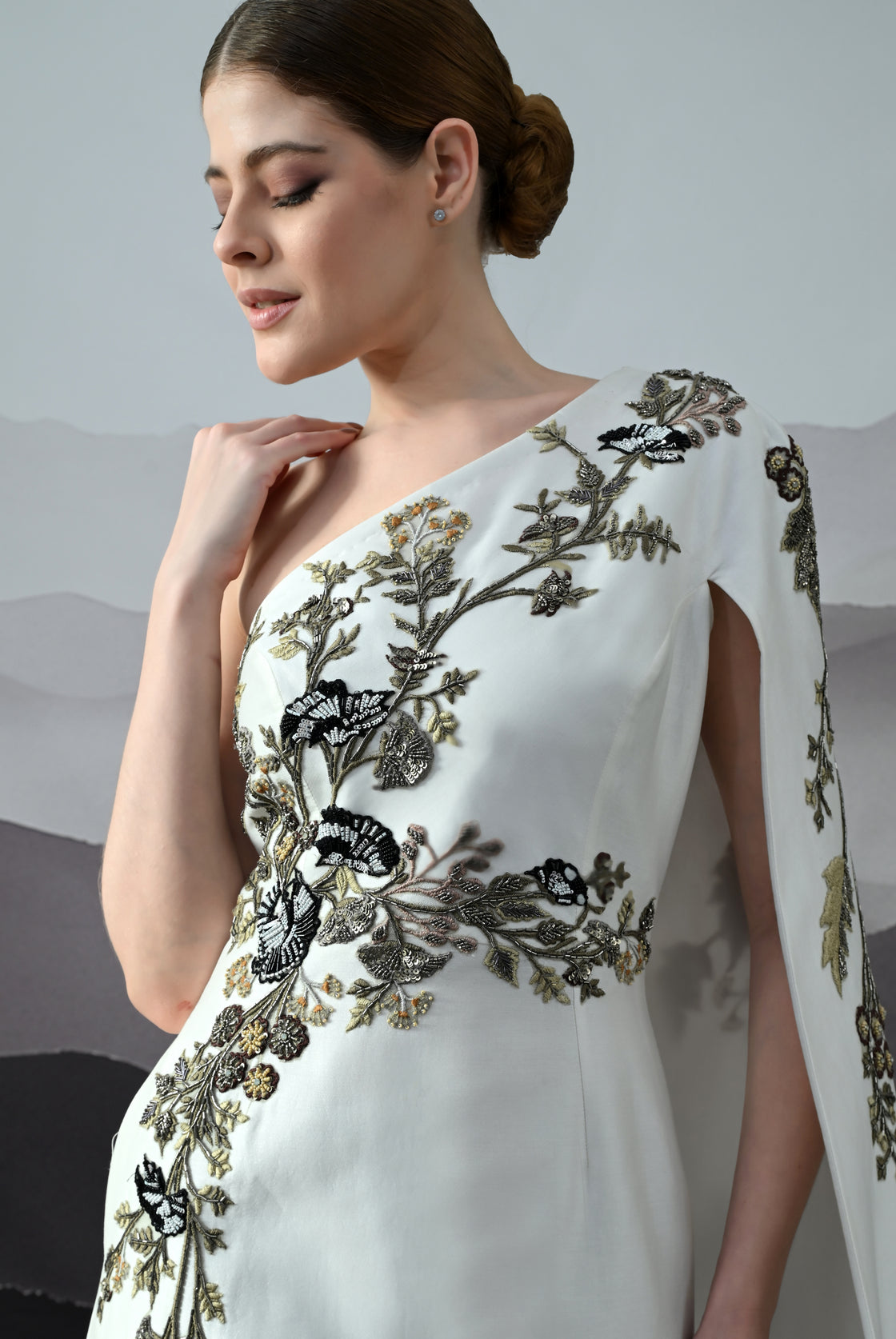 Elegant  Gown Featuring a One-Shoulder Bodice with Embroidered Detailing