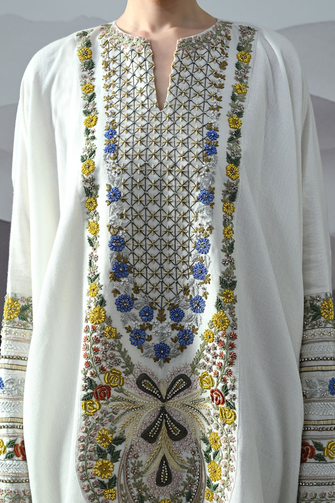 Ivory Kaftan With Hand-Embroidered Floral Work And Geometric Borders