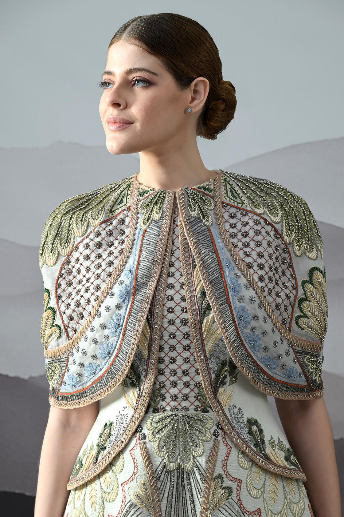 Ivory Silhouette With Artisanal Handwork And Layered Construction