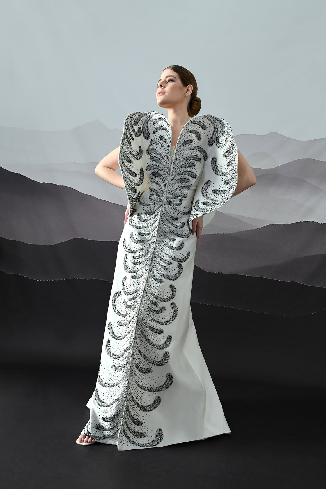 Ivory Gown With Hand-Embroidered Monochrome Motifs And Structured Silhouette