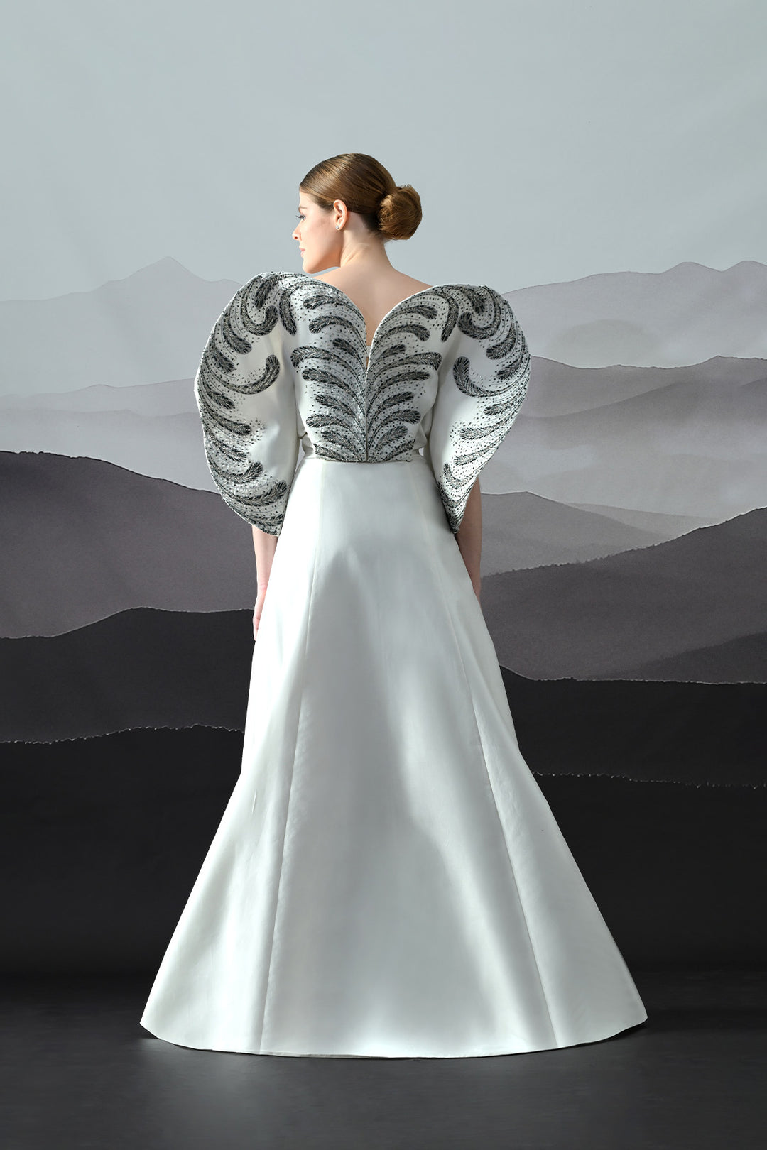 Ivory Gown With Hand-Embroidered Monochrome Motifs And Structured Silhouette