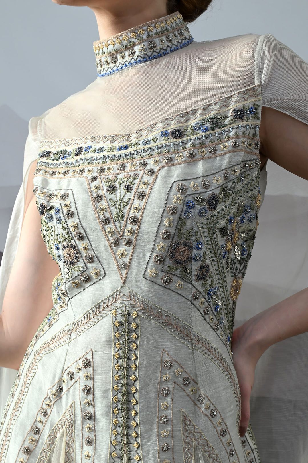 Ivory High Neck Gown With Handworked Panelled Embroidery