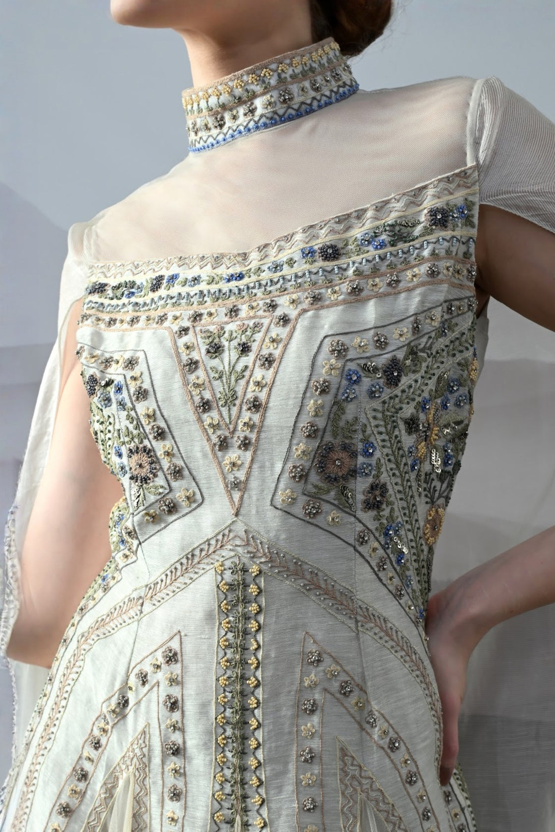 Ivory High Neck Gown With Handworked Panelled Embroidery