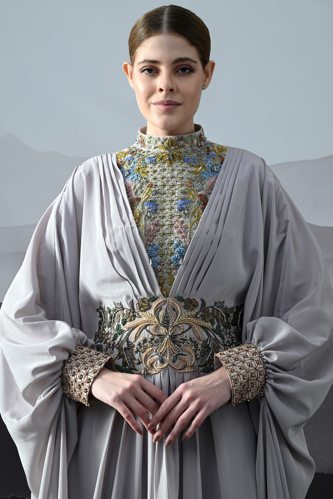 Soft Grey Draped Gown With Hand-Embroidered High Neck And Floral Waist Detail