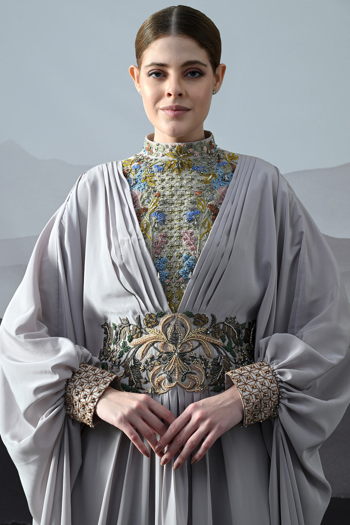Soft Grey Draped Gown With Hand-Embroidered High Neck And Floral Waist Detail