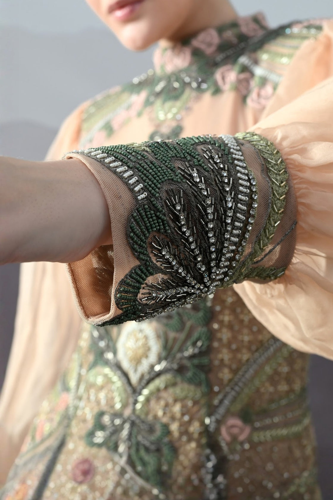 Soft Peach Gown With Sculpted Corsetry And Artisanal Embroidery