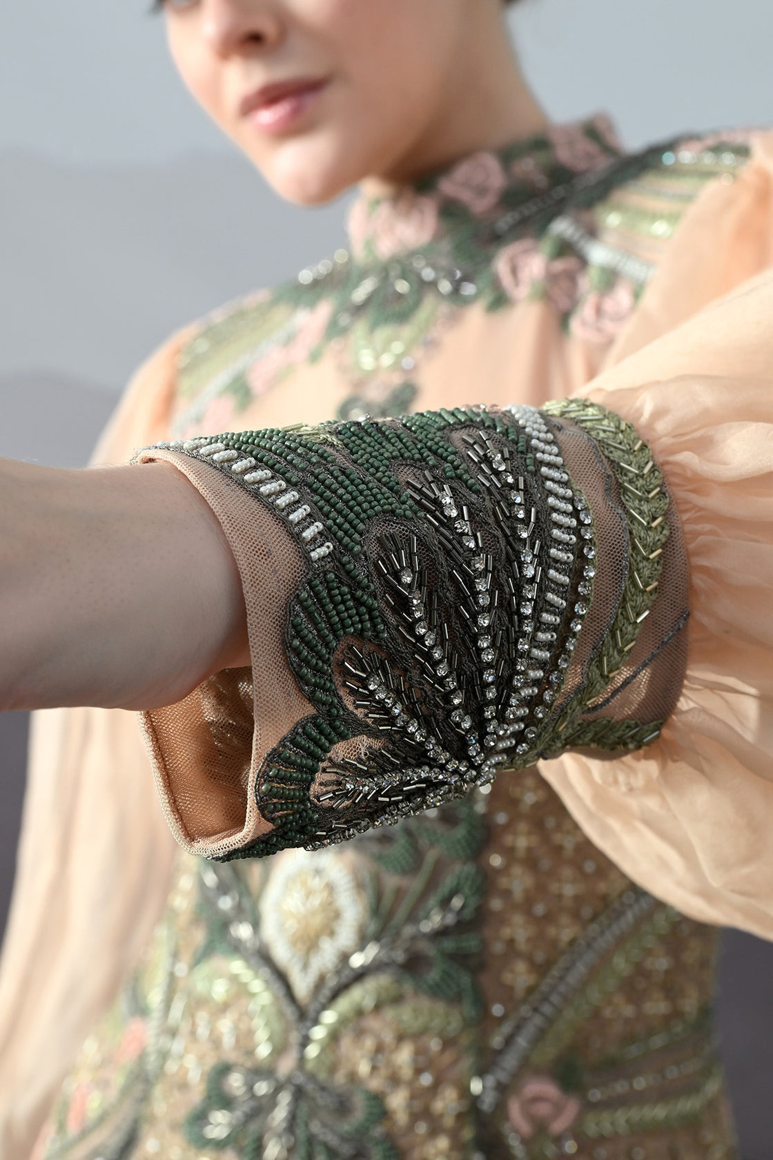 Soft Peach Gown With Sculpted Corsetry And Artisanal Embroidery