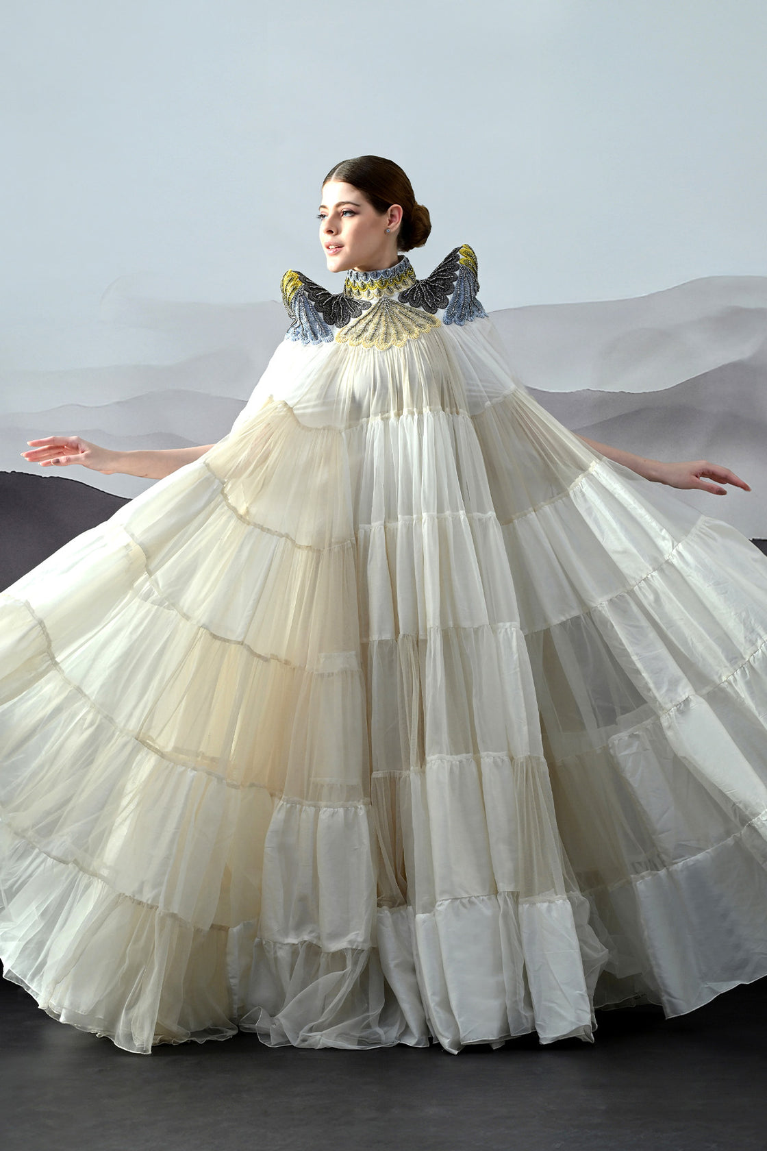 Ivory Dress Featuring Hand-Embroidered High Neck And Cascading Tiered Layers