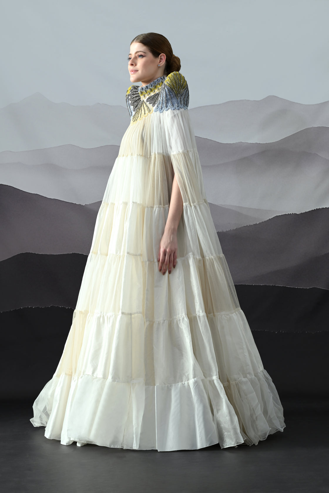 Ivory Gown Featuring Hand-Embroidered High Neck and Cascading Tiered Layers