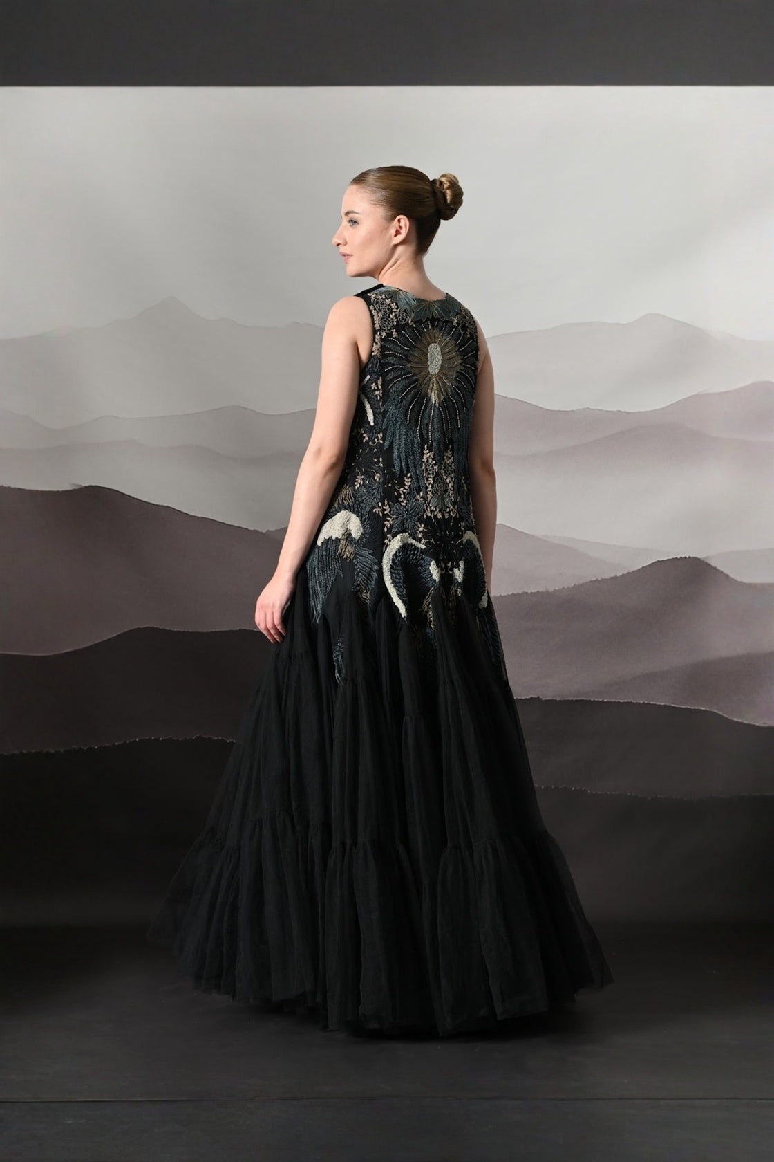 Black Gown With Radiating Hand Embroidery And Soft Tiered Movement