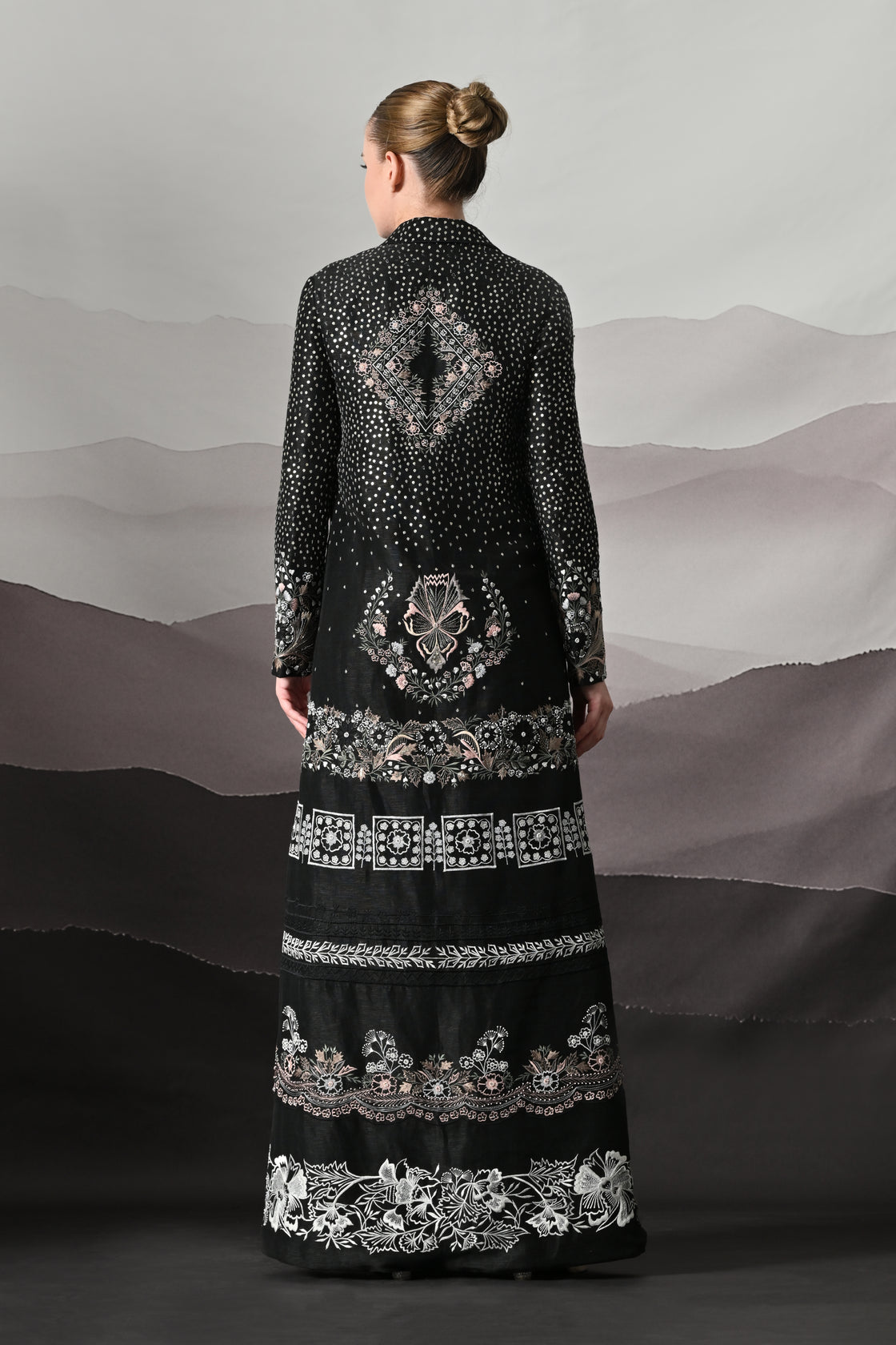 Black Kaftan Defined by Precision Handwork and Vertical Continuity