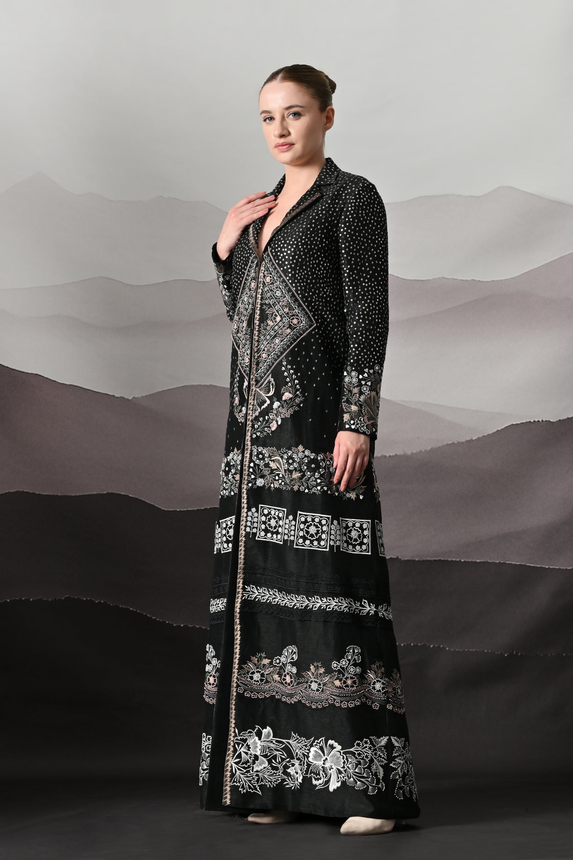 Black Kaftan Defined by Precision Handwork and Vertical Continuity