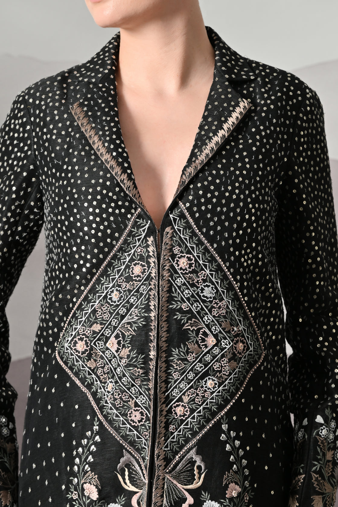 Black Kaftan Defined by Precision Handwork and Vertical Continuity