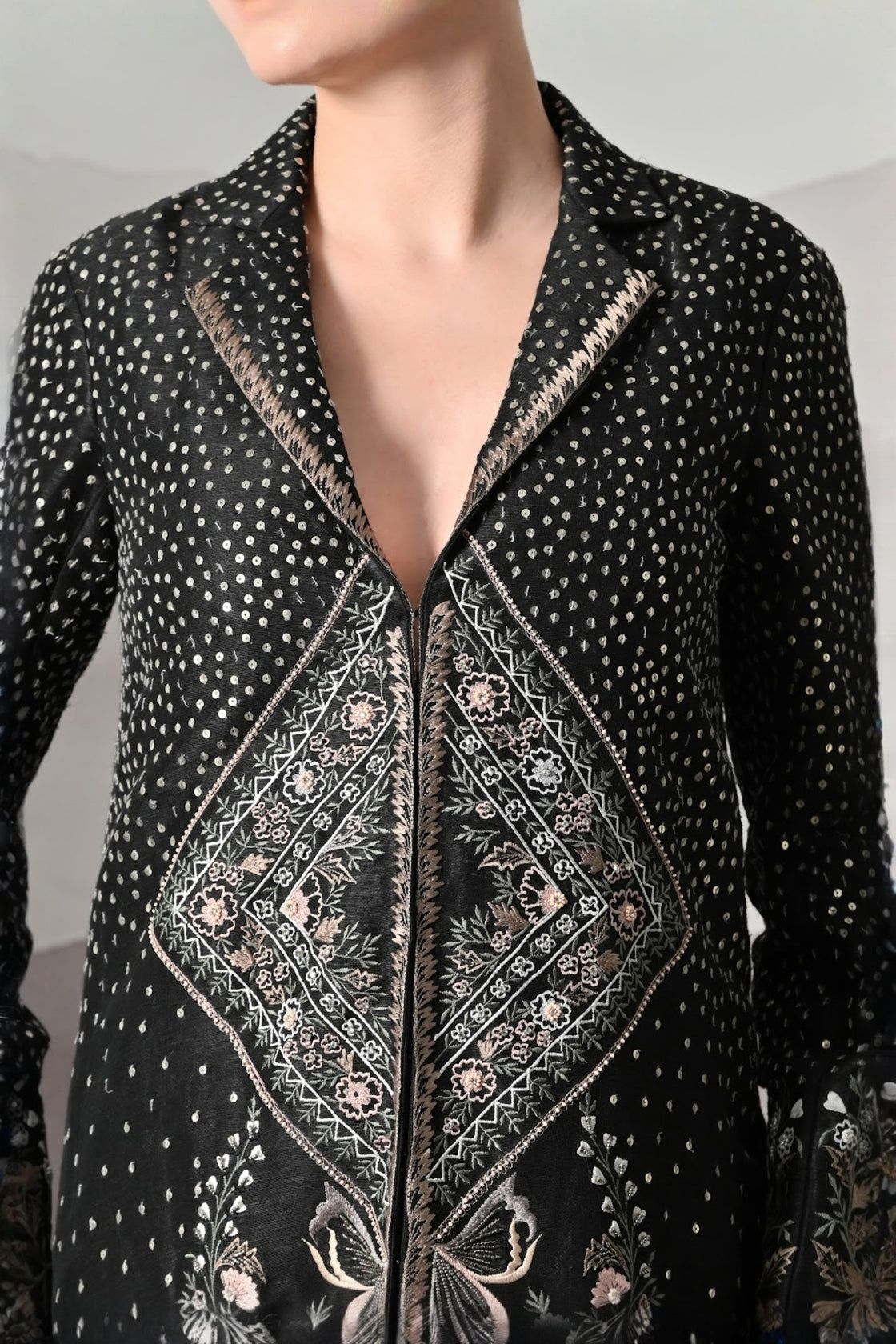 Black Jacket Defined By Precision Handwork And Vertical Continuity