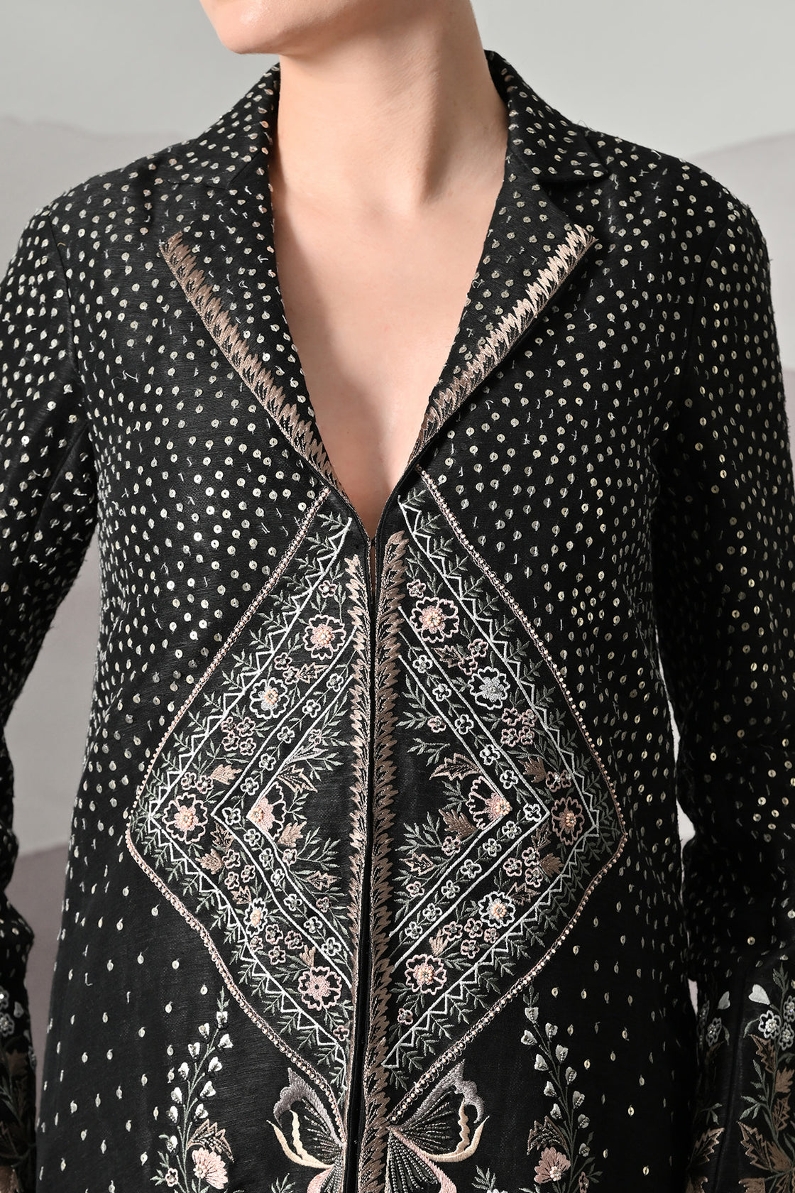 Black Jacket Defined By Precision Handwork And Vertical Continuity