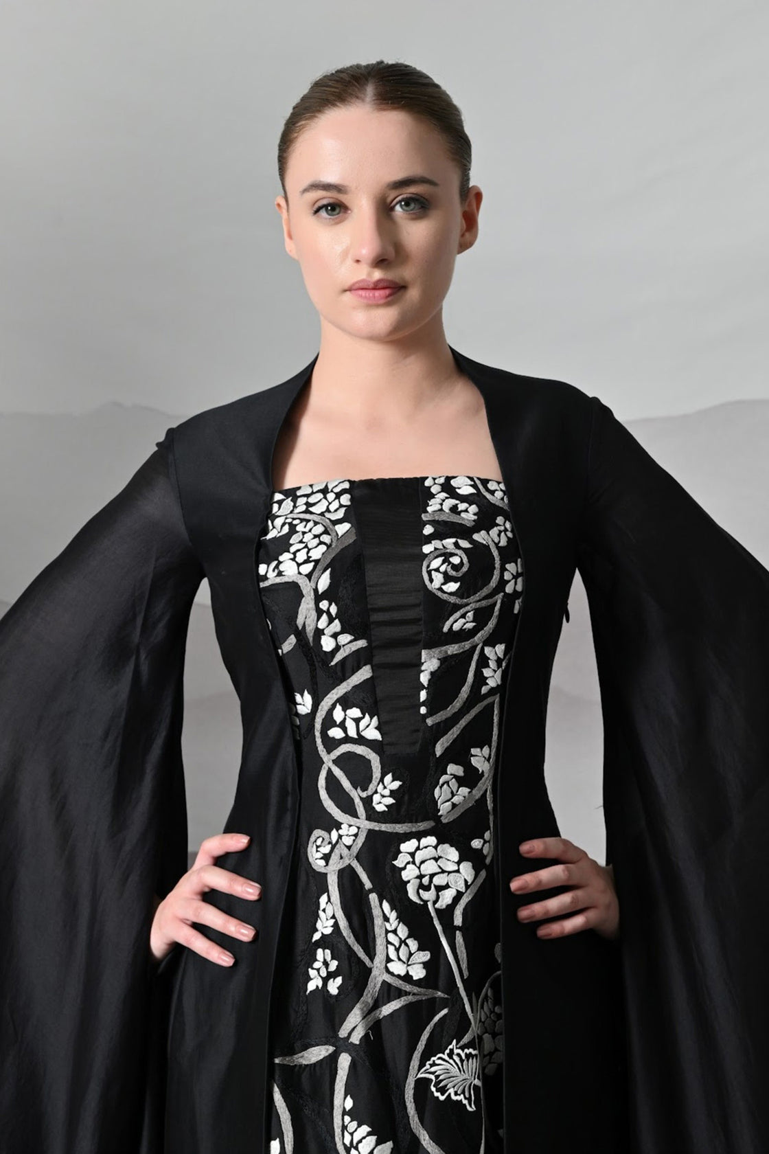 Black Gown With Winged Draped Panels And Handwork Embroidery