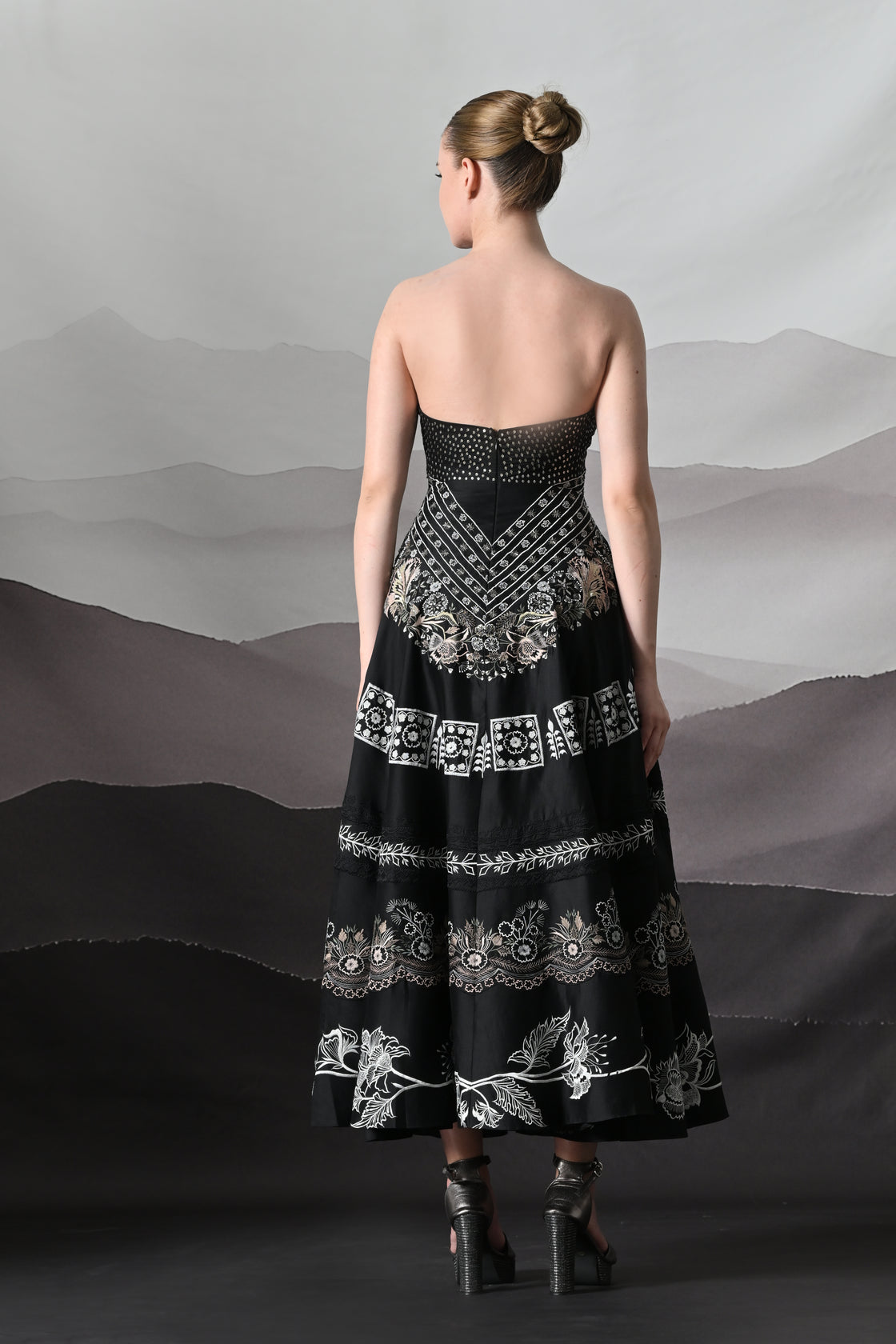 Black Kaftan Defined by Precision Handwork and Vertical Continuity