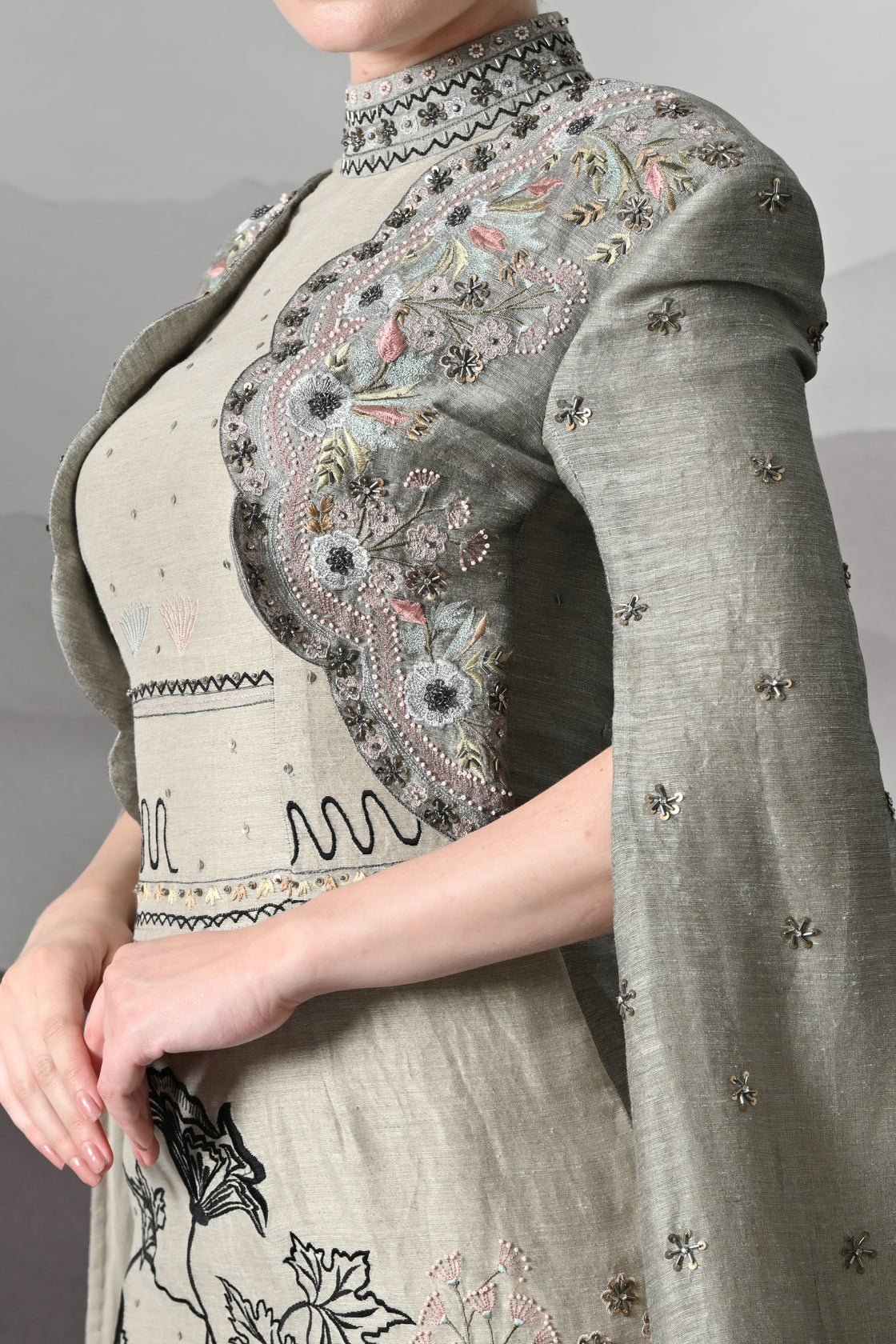 Grey Gown with Hand-Embroidered Linear Detail and Structured Drape