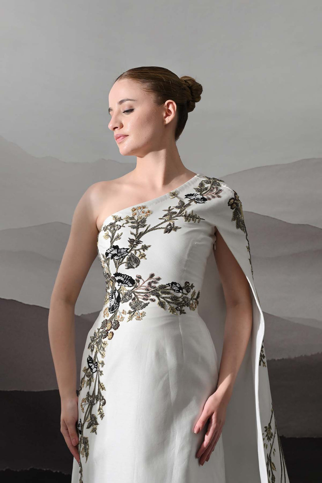 Elegant  Gown Featuring A One-Shoulder Bodice With Embroidered Detailing