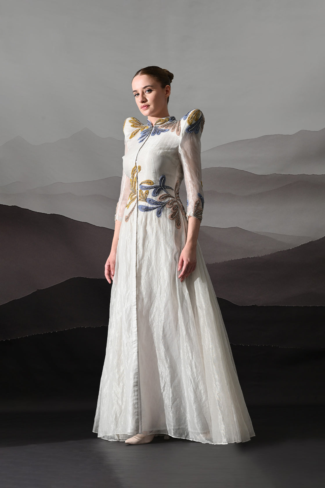 White Gown With Artisanal Floral Embroidery And Structured Silhouette