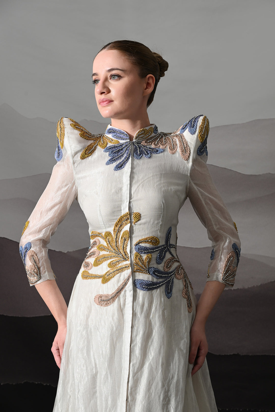 White Gown With Artisanal Floral Embroidery And Structured Silhouette