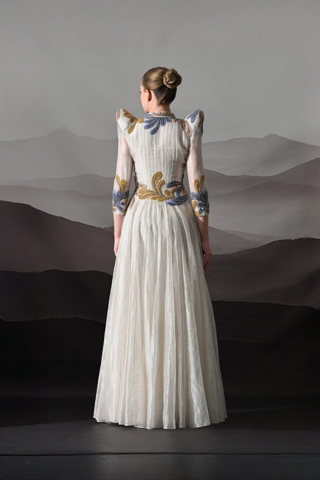White Gown With Artisanal Floral Embroidery And Structured Silhouette
