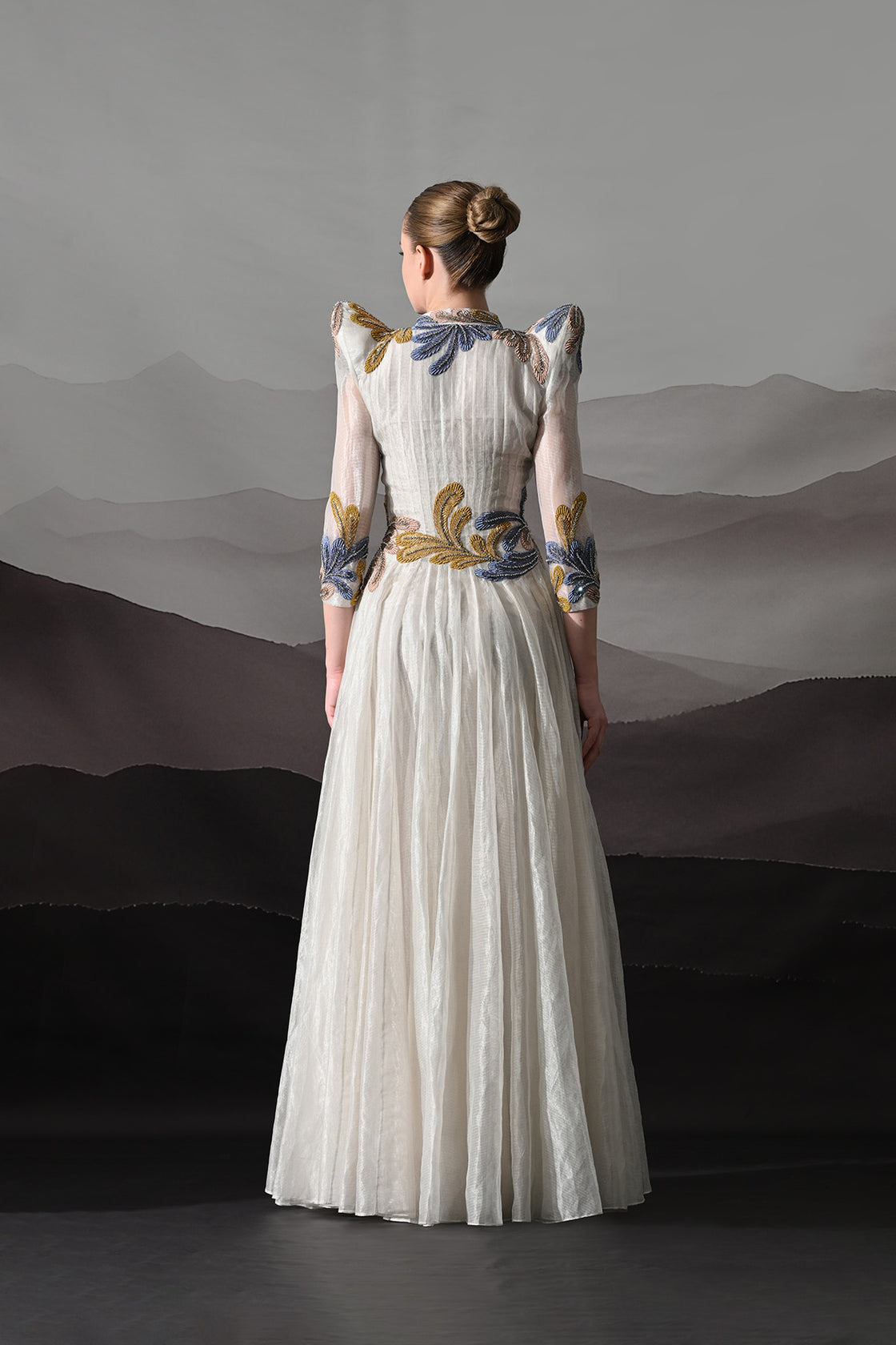 White Gown With Artisanal Floral Embroidery And Structured Silhouette