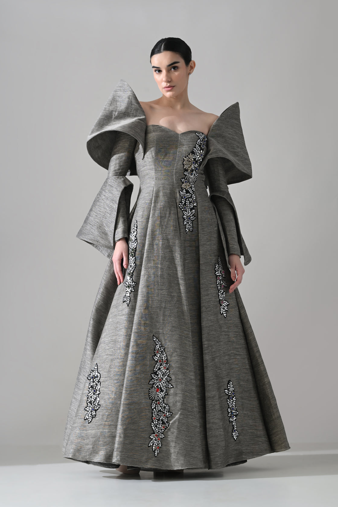 Grey Gown with Embellished Panels and Architectural Sleeves