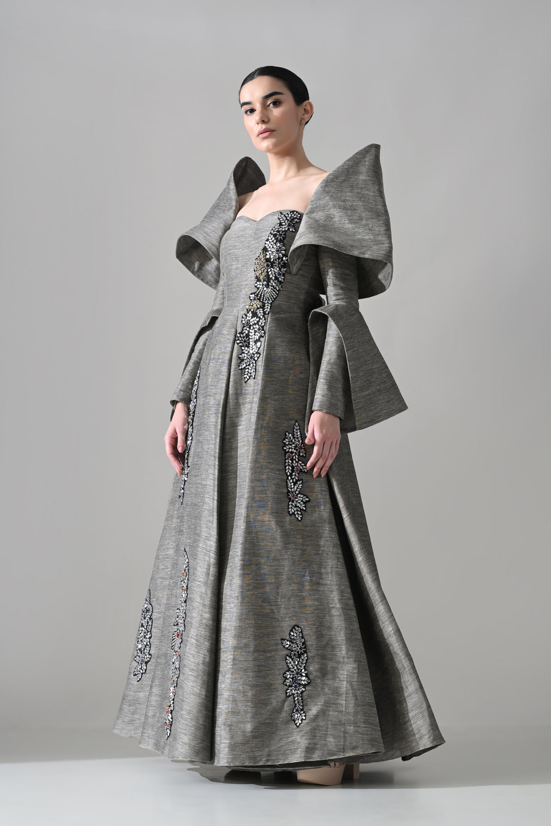 Grey Gown with Embellished Panels and Architectural Sleeves
