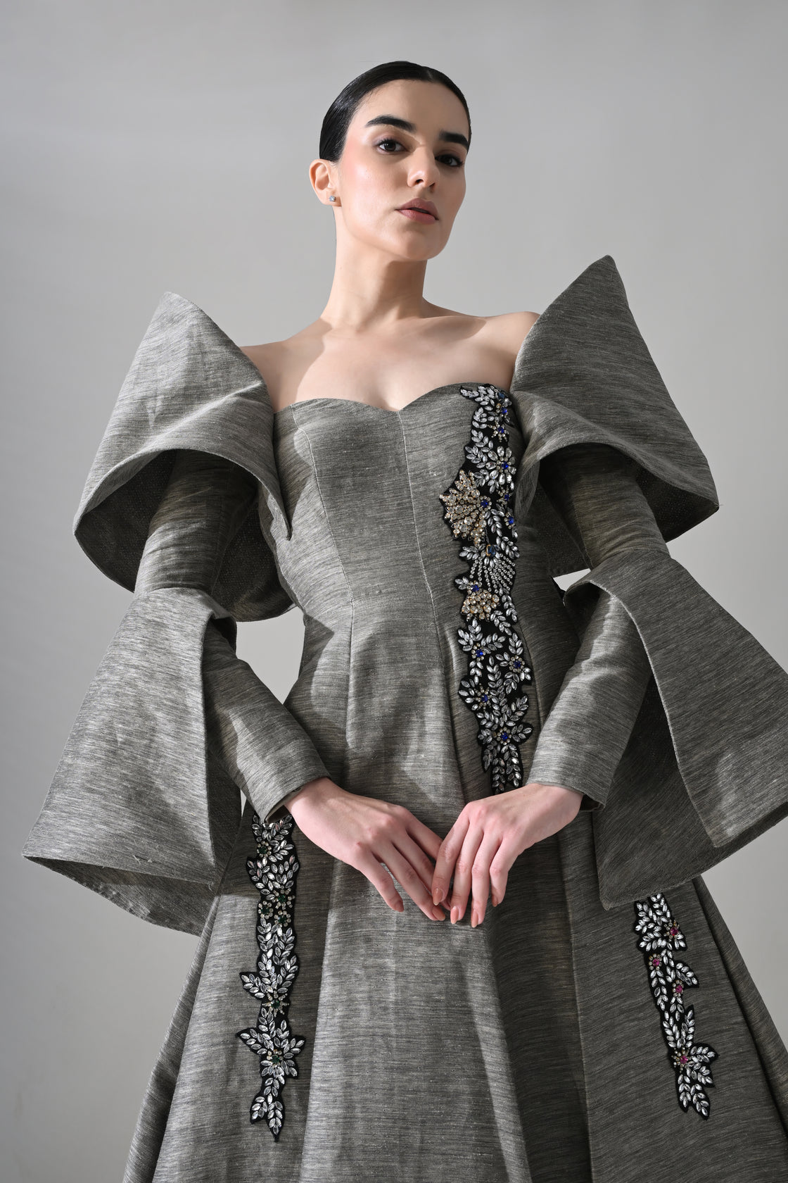 Grey Gown with Embellished Panels and Architectural Sleeves