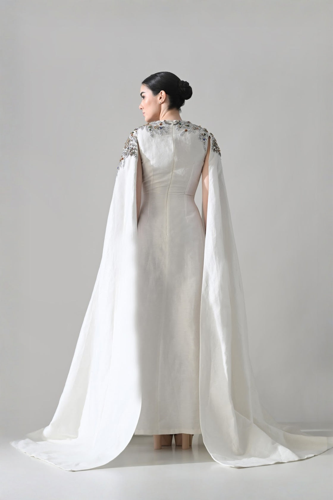 Ivory Gown With Hand-Embellished Shoulders And Draped Cape Sleeves Overlay