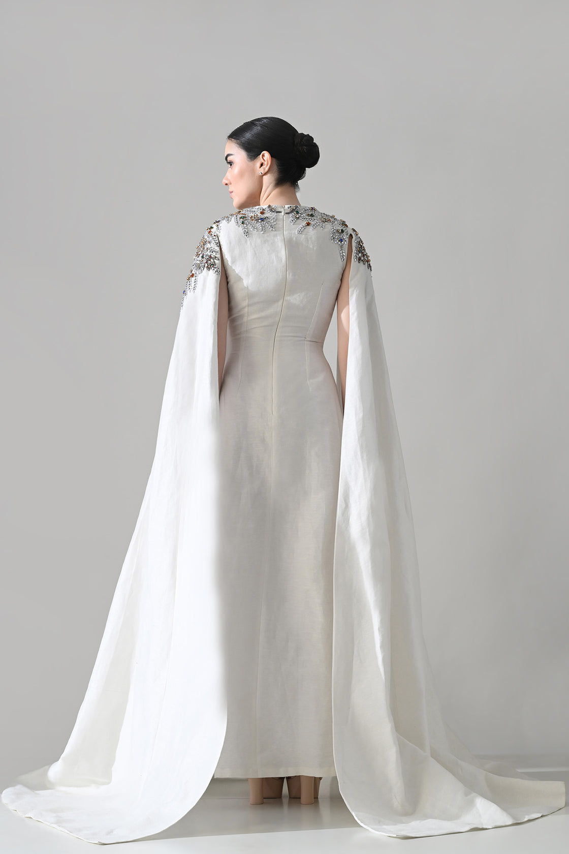 Ivory Gown With Hand-Embellished Shoulders And Draped Cape Sleeves Overlay