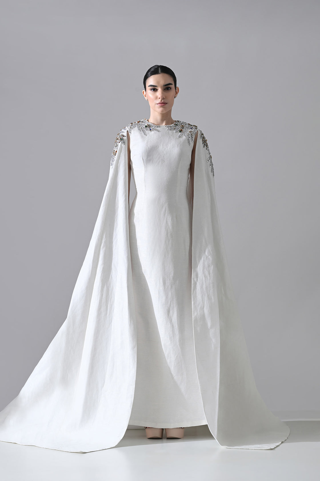 Ivory Gown With Hand-Embellished Shoulders And Draped Cape Sleeves Overlay