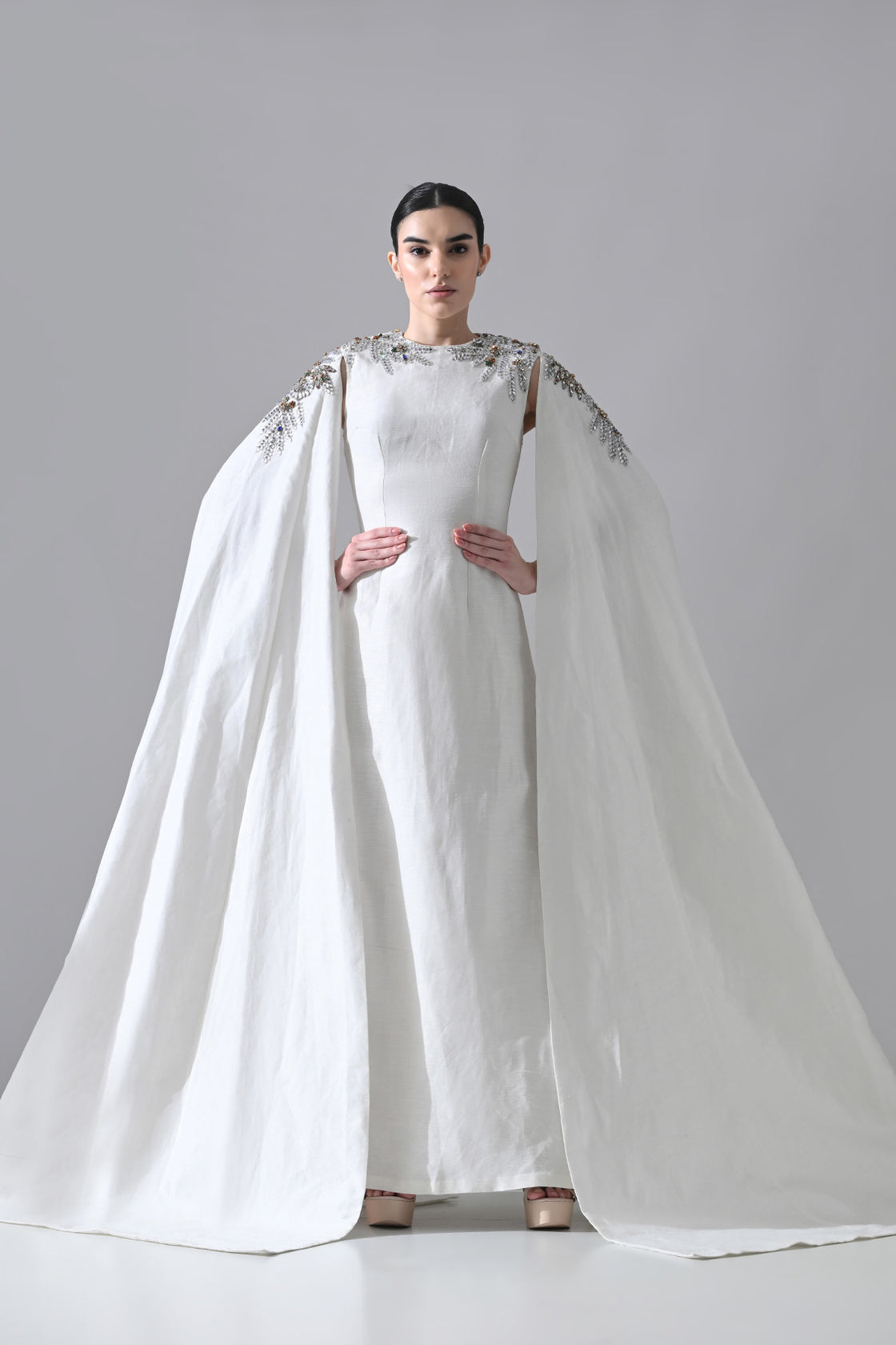 Ivory Gown With Hand-Embellished Shoulders And Draped Cape Sleeves Overlay