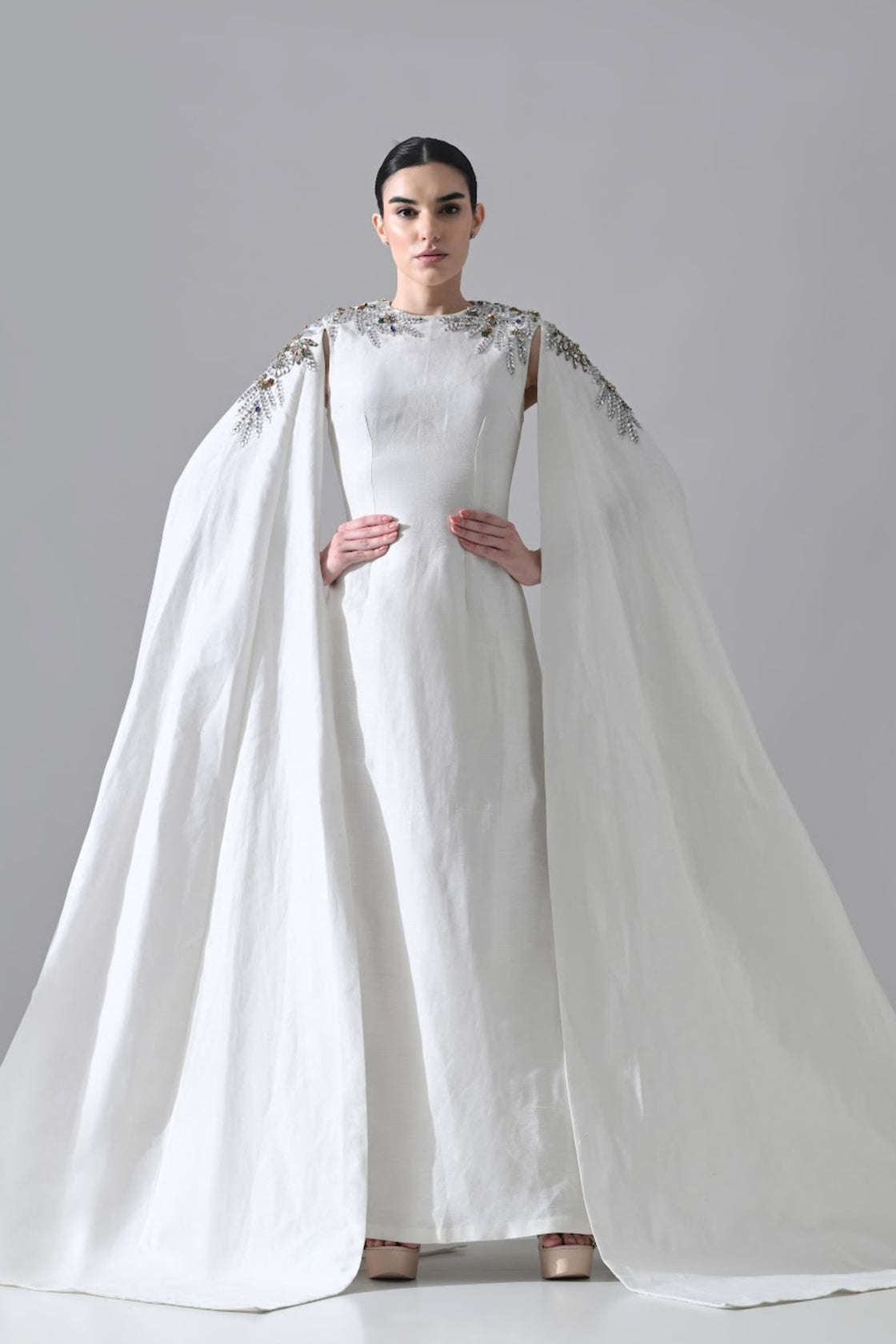 Ivory Gown With Hand-Embellished Shoulders And Draped Cape Sleeves Overlay
