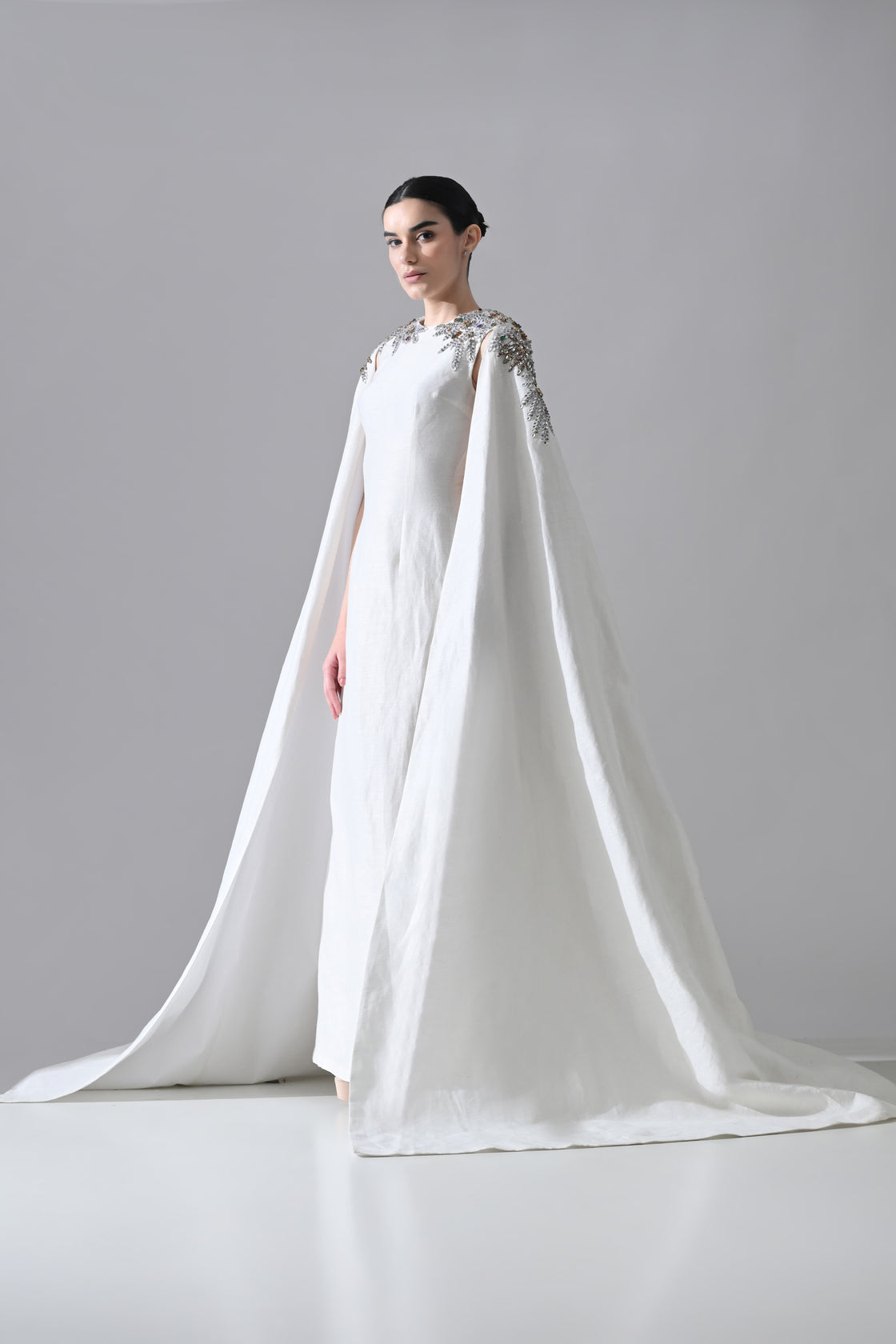 Ivory Gown with Hand-Embellished Shoulders and Draped Cape Sleeves