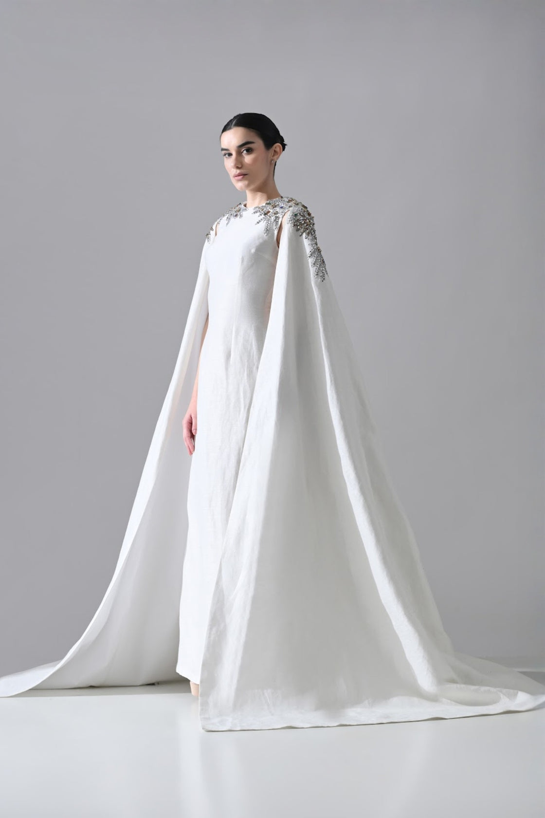 Ivory Gown With Hand-Embellished Shoulders And Draped Cape Sleeves Overlay