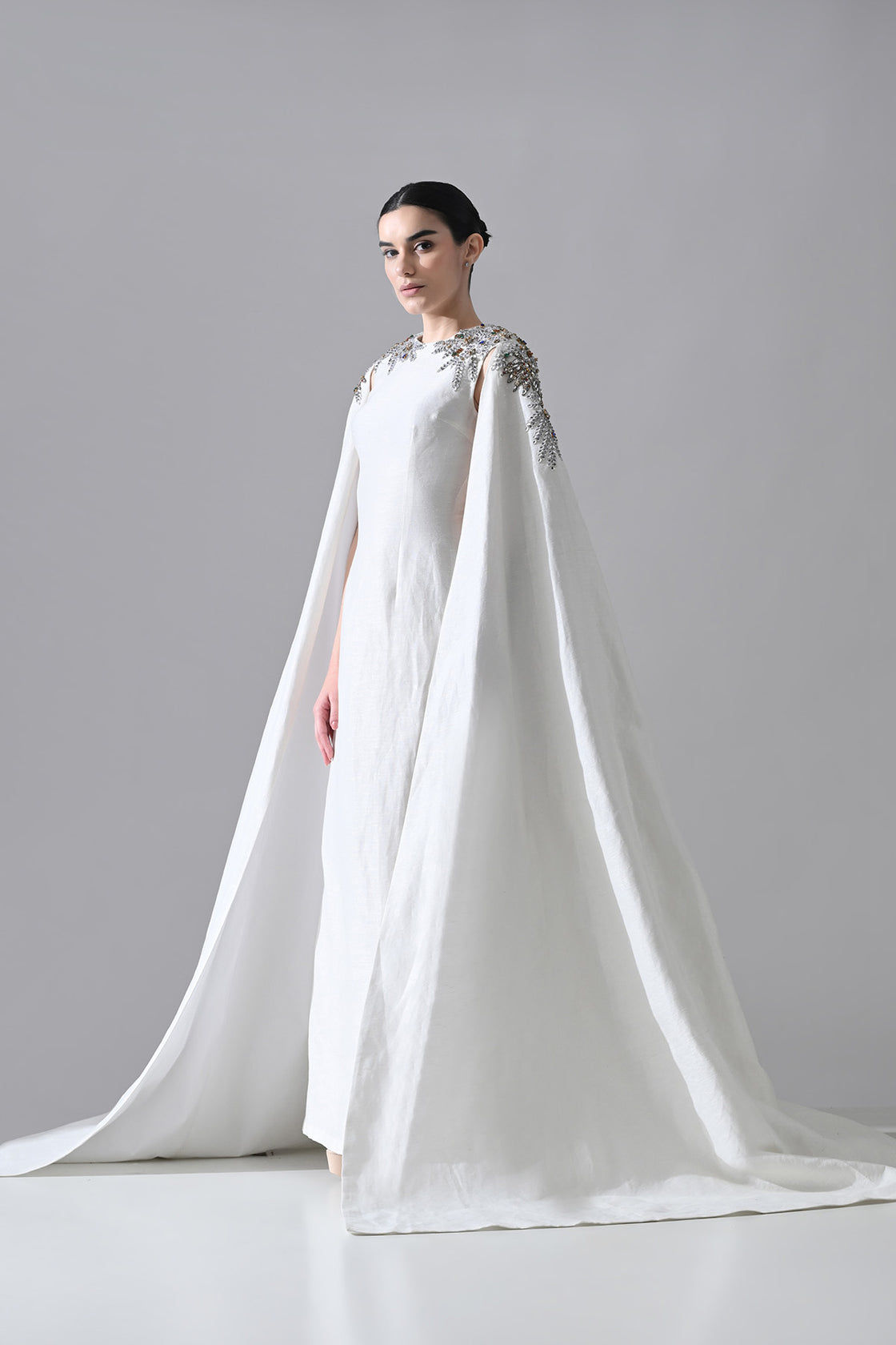 Ivory Gown With Hand-Embellished Shoulders And Draped Cape Sleeves Overlay
