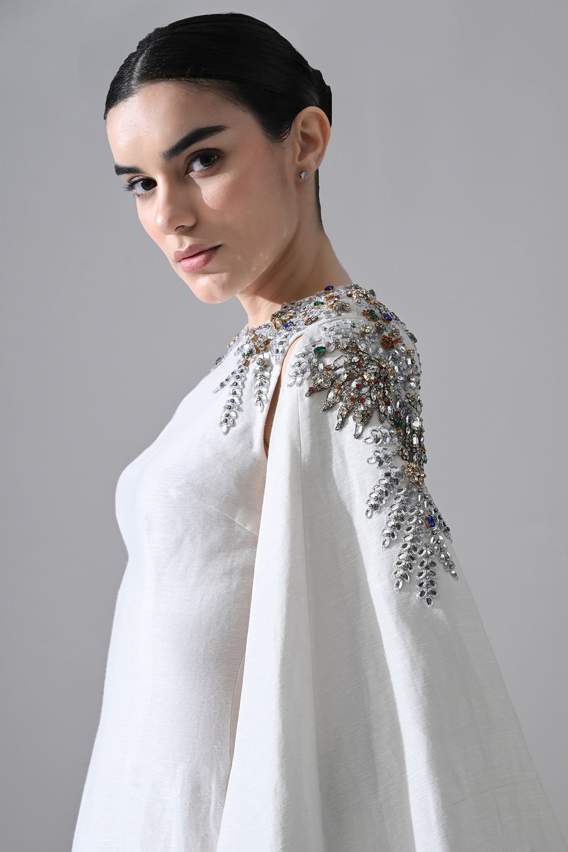 Ivory Gown With Hand-Embellished Shoulders And Draped Cape Sleeves Overlay