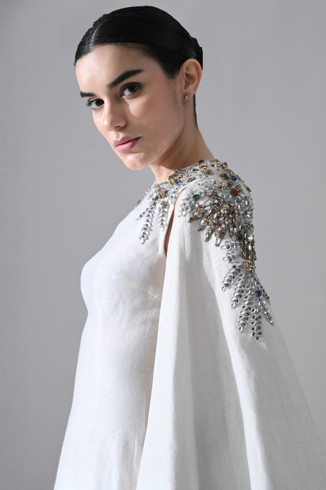 Ivory Gown With Hand-Embellished Shoulders And Draped Cape Sleeves Overlay