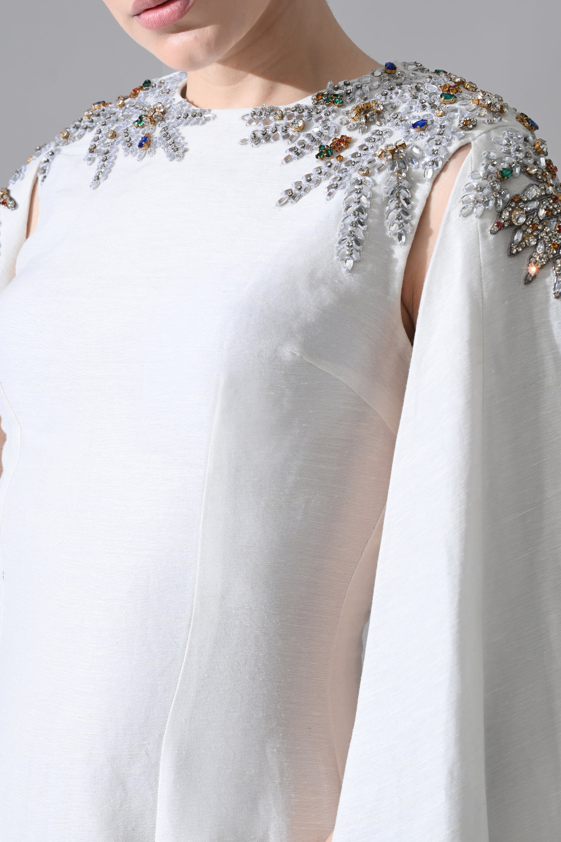 Ivory Gown with Hand-Embellished Shoulders and Draped Cape Sleeves