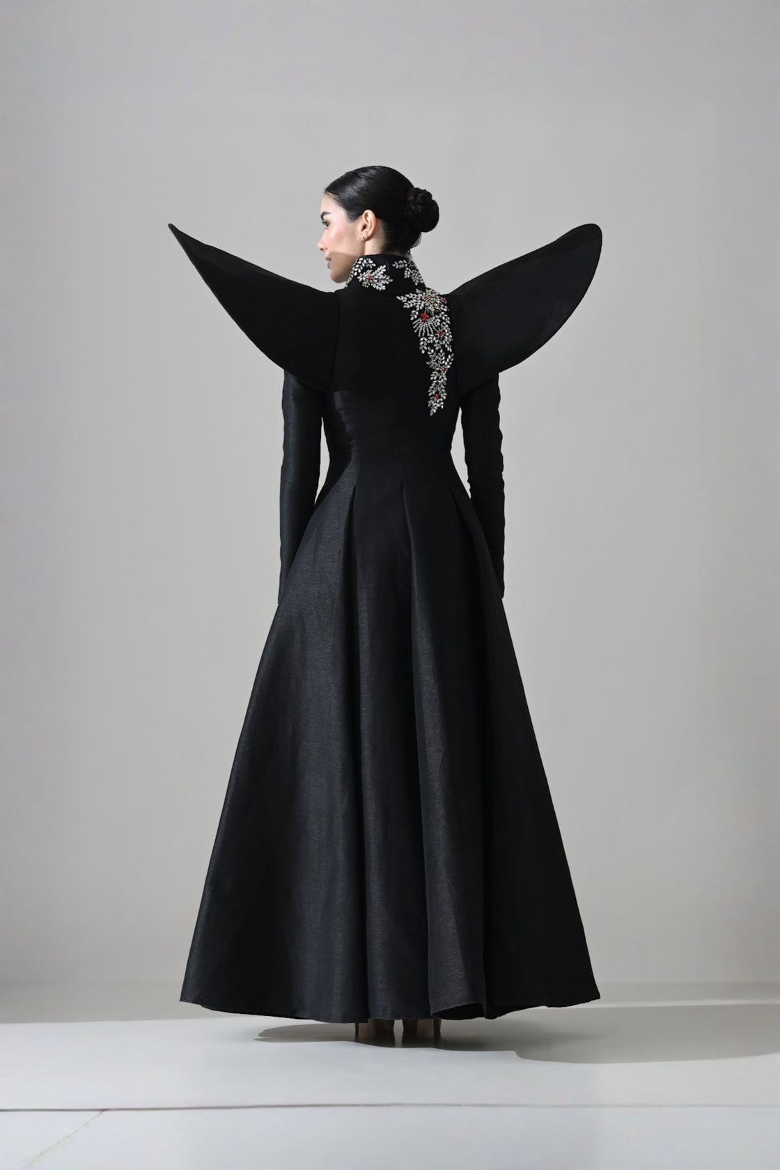 Black Gown With Winged Shoulders And Cascading Hand Embroidery