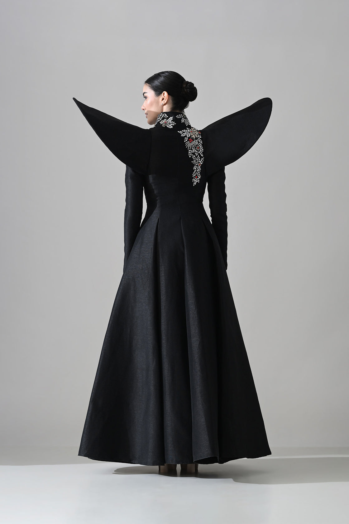 Black Gown With Winged Shoulders And Cascading Hand Embroidery