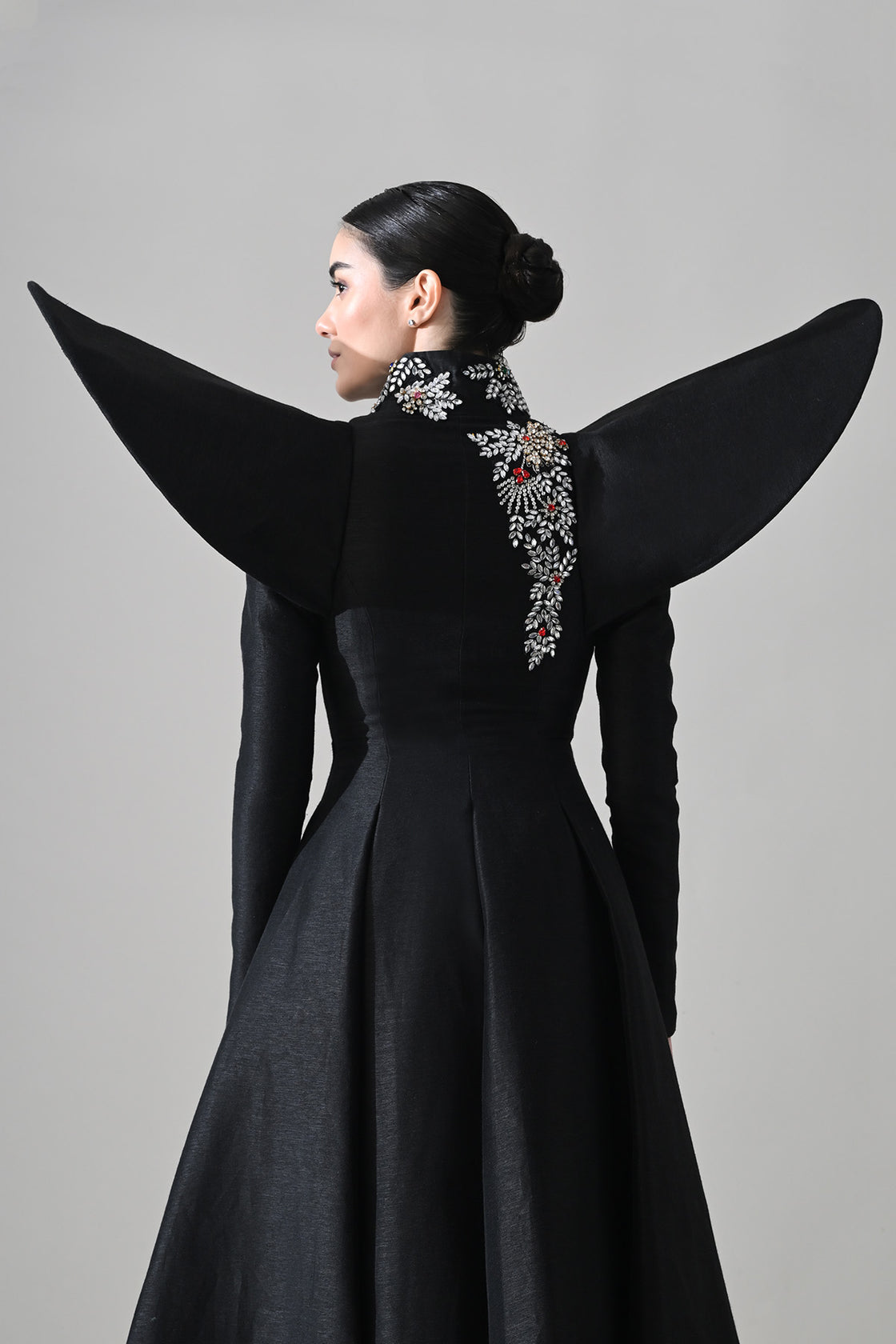 Black Gown With Winged Shoulders And Cascading Hand Embroidery