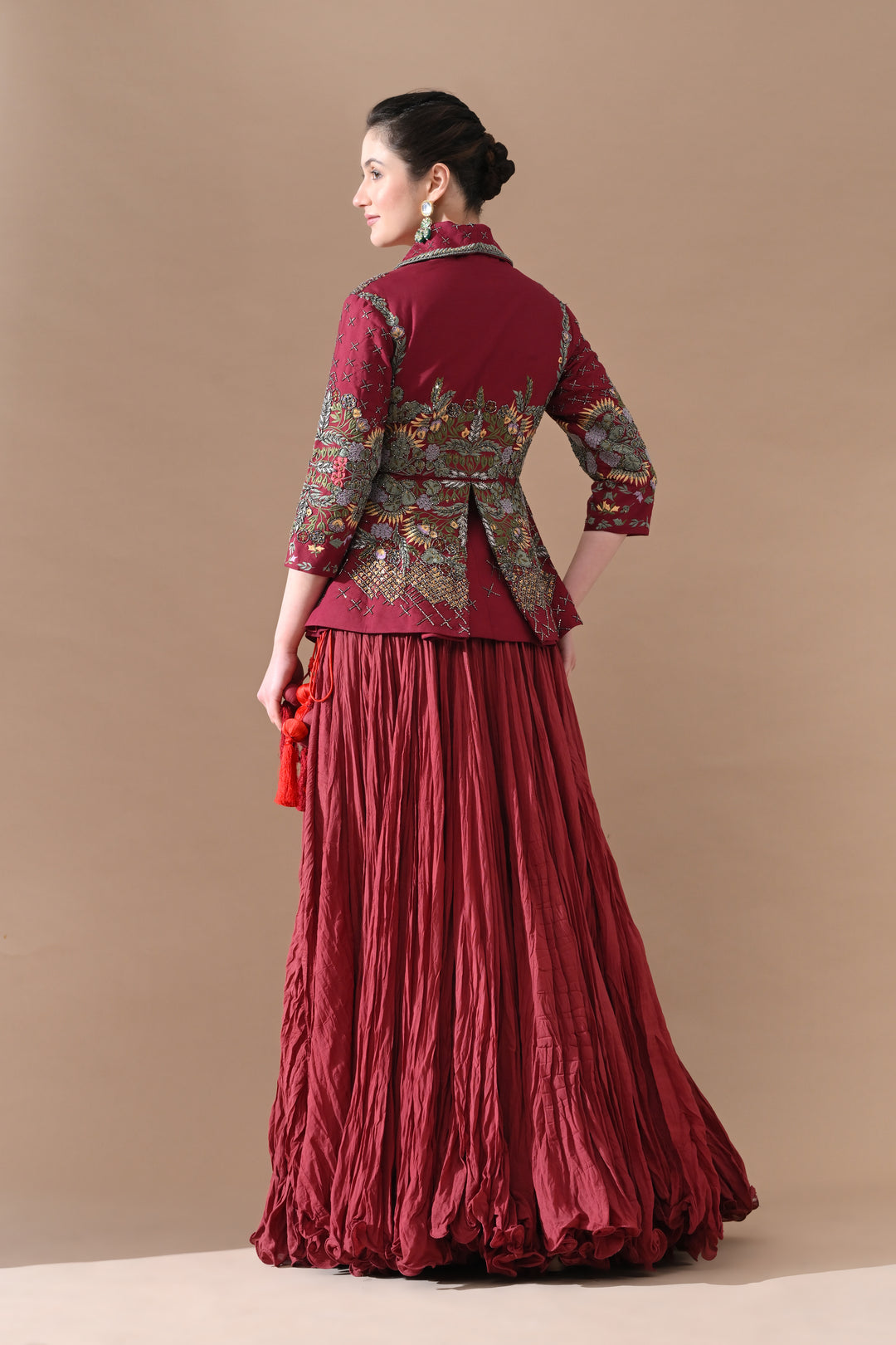 A Maroon Jacket Features Intricate All-Over Embroidery With Skirt
