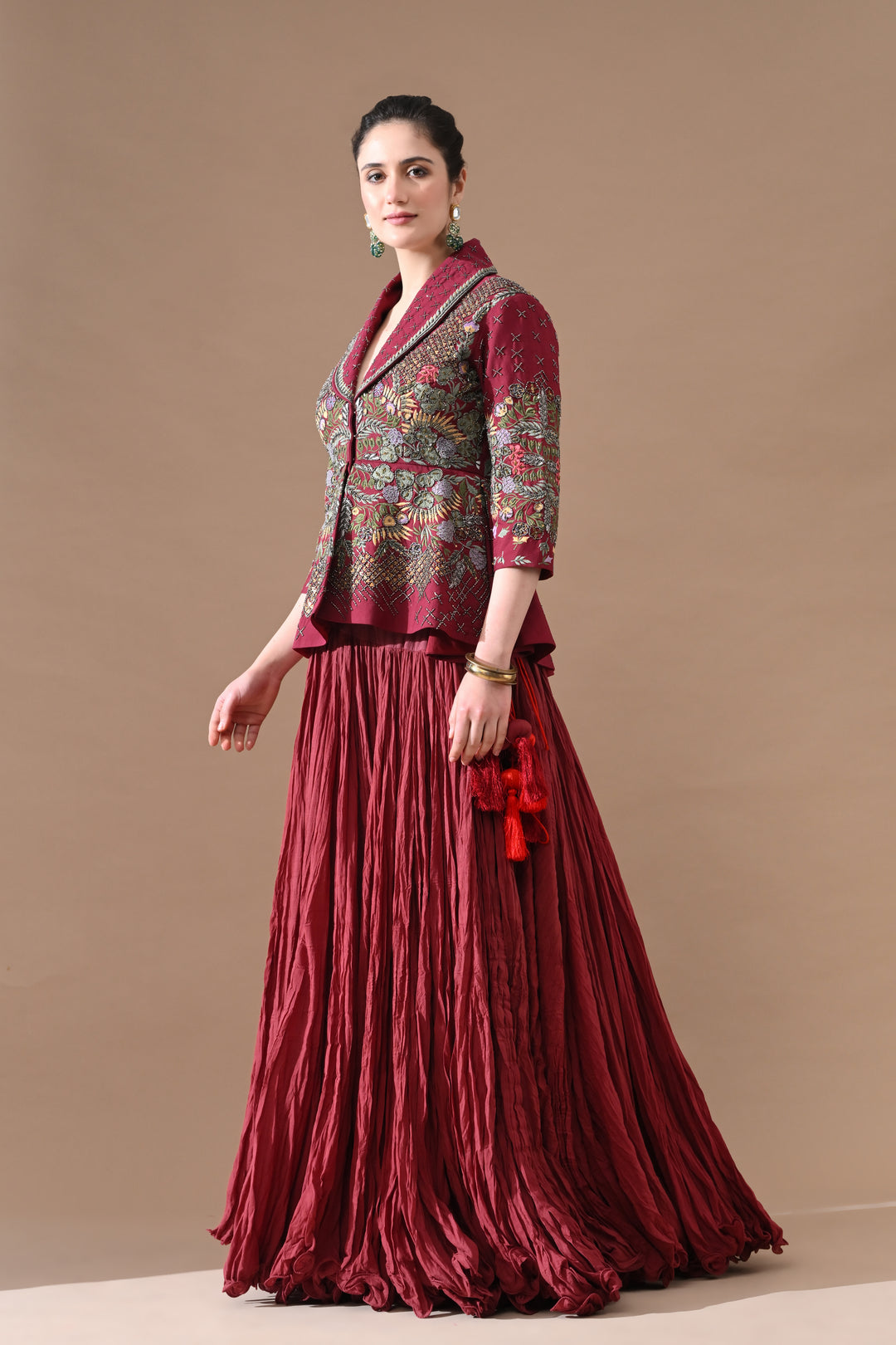 A Maroon Jacket Features Intricate All-Over Embroidery With Skirt
