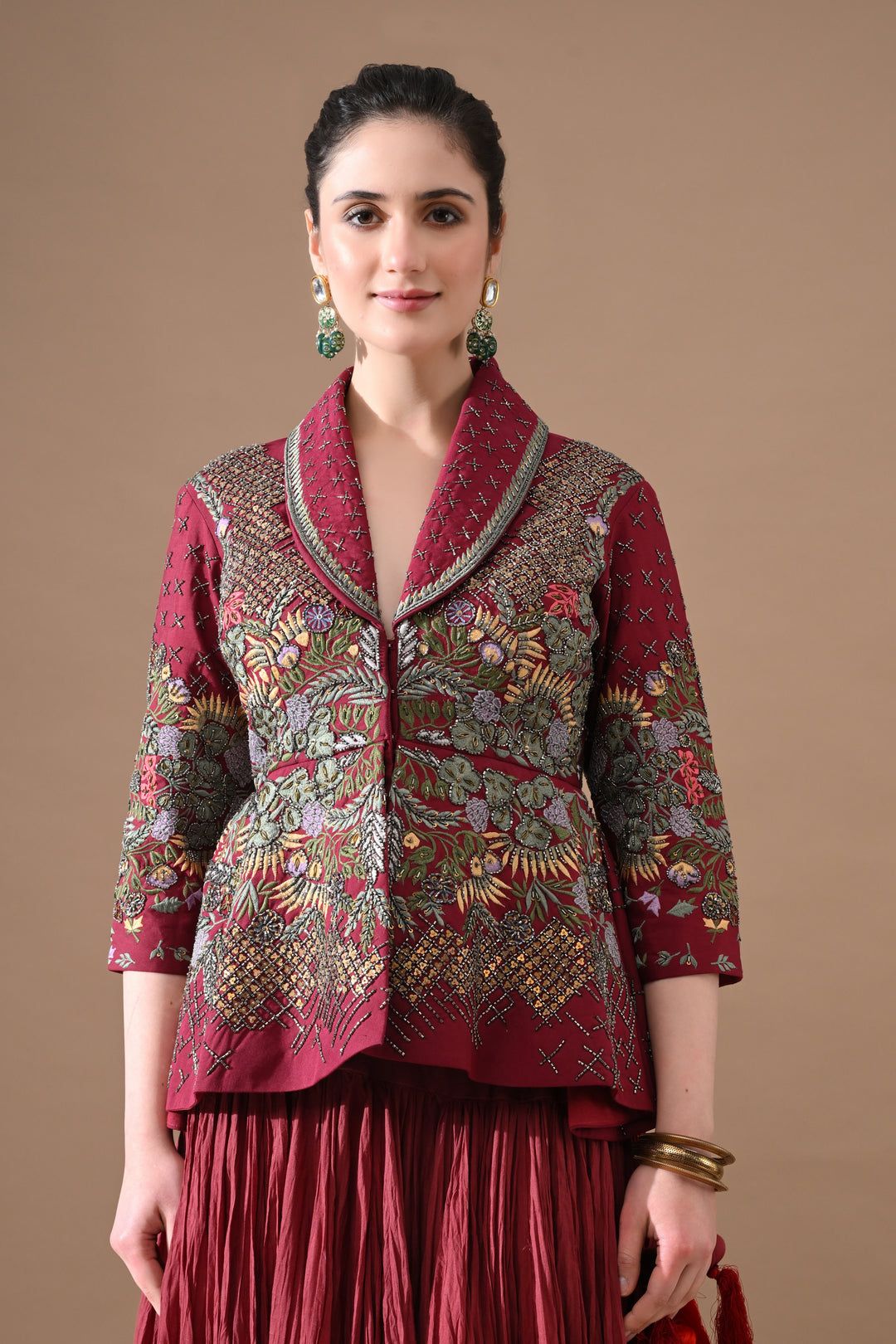 A Maroon Jacket Features Intricate All-Over Embroidery With Skirt