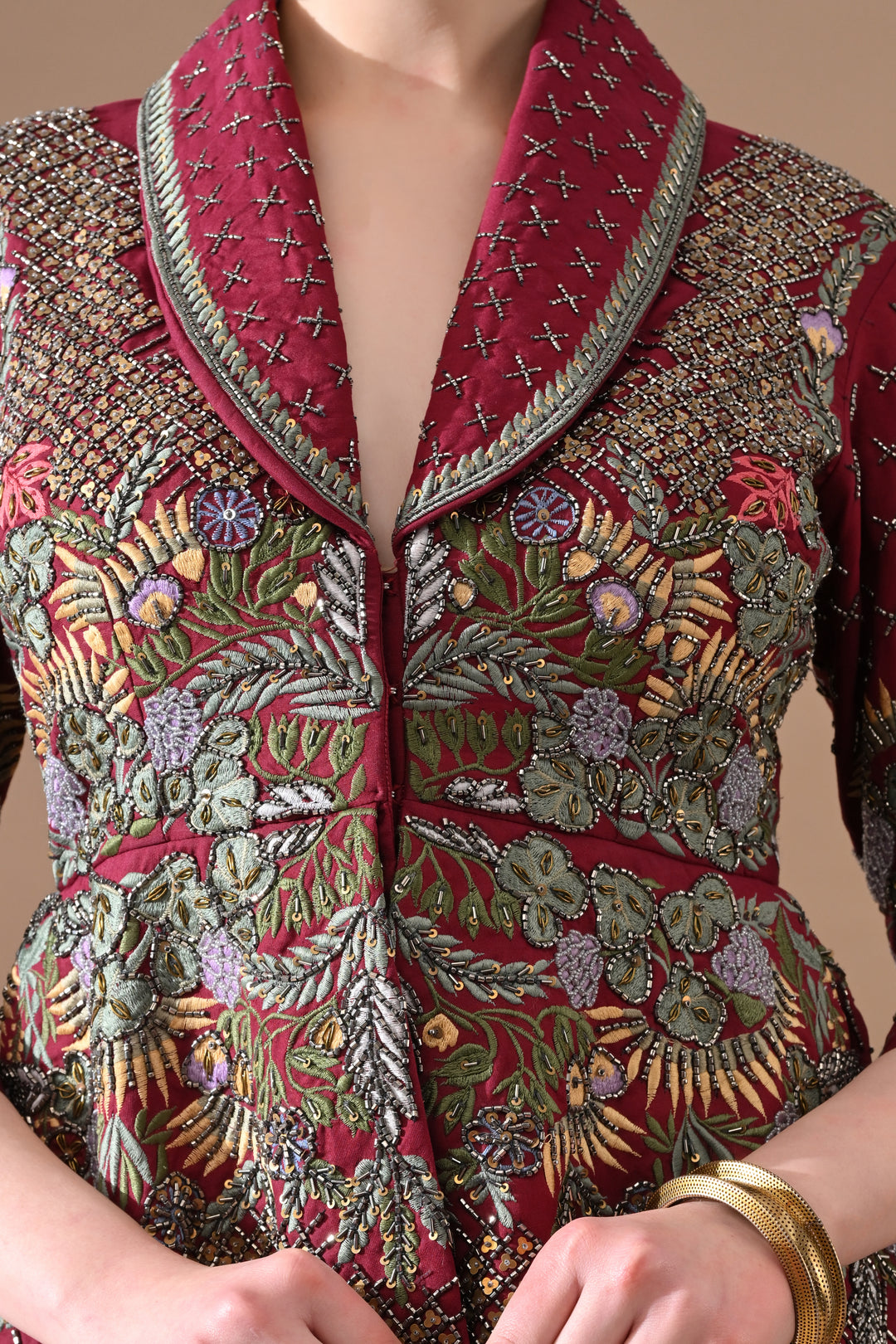 A Maroon Jacket Features Intricate All-Over Embroidery With Skirt